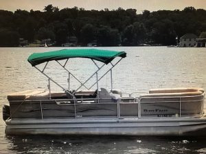 pontoon boat with green canopy